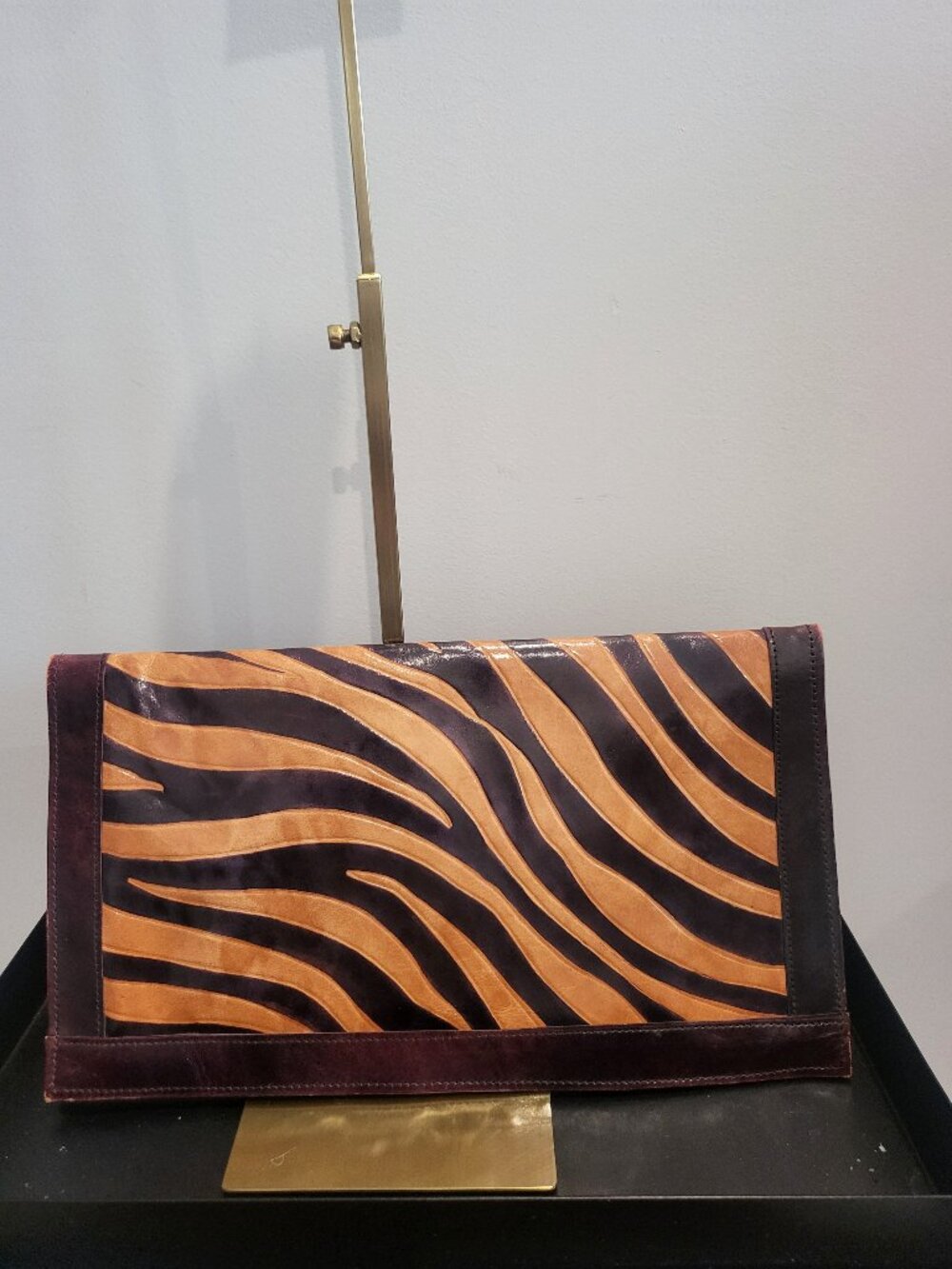 Large rectangular zebra print clutch in brown and tan leather